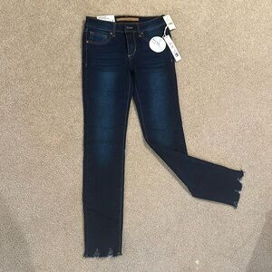 New with tag Joe’s girl size 12 mid rise skinny dark denim jeans.